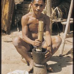 Man grinding gunpowder