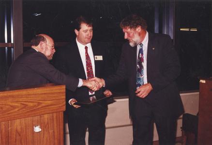 Joel Rodney and Gary Britton shaking hands
