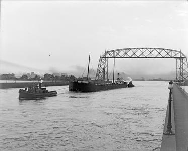 Barge Manda Under Tow of Tug Record and Unidentified Tug