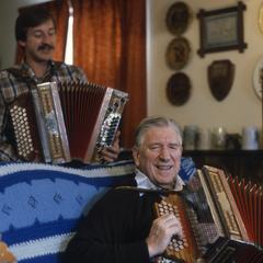 Karl Hacker, Jr. and Sr. play accordion