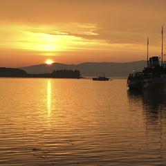 Oban harbor, sunset with boats at anchor