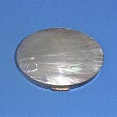 Oval compact with faux mother-of-pearl lid
