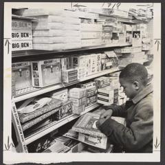 A young shopper selects toys in the toy department