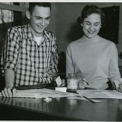 Sigma Tau Gamma - male and female student working on a publication layout