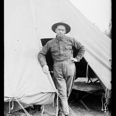 Soldier in front of military tent
