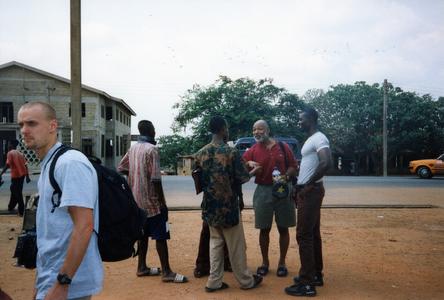 Jim Stills speaking with a group of young men