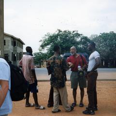 Jim Stills speaking with a group of young men