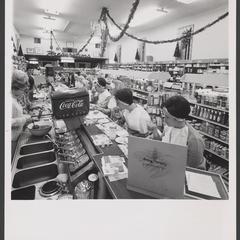 Women eat at a drugstore lunch counter