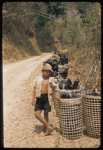 Kammu (Khmu') boy with charcoal