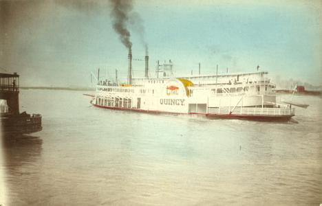 Side view of Quincy underway on river