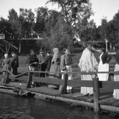 Men and women on boardwalk
