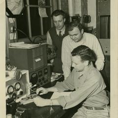 Radio Club members working with telegraph machine