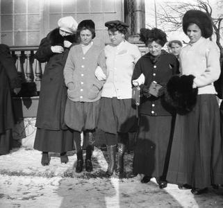 Women standing together in snow