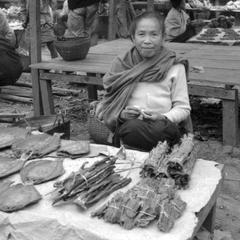 Lao woman selling dried fish