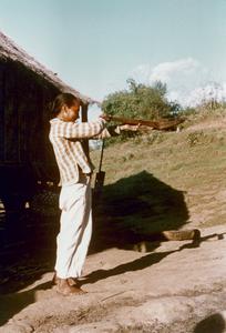 White Lahu (Lahu Hpu) man aims his crossbow in the village of Chalopha in Houa Khong Province