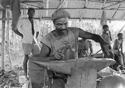 Blacksmith at Work on Anvil