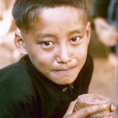 White Hmong boy with top at the village of Nam Phet in Houa Khong Province