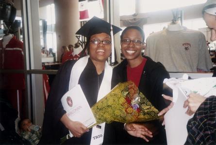 Female student and friend at 2002 graduation