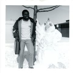 Posing with snow sculpture