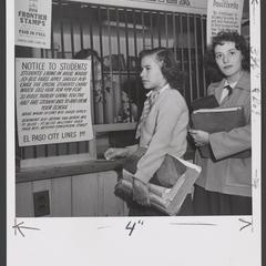 Students stand at a drugstore cashier counter