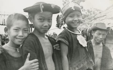 Akha boys and girl in the village of Phate, Houa Khong Province
