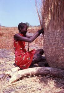 Woman Weaving a Granary