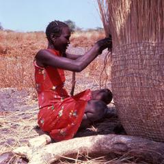 Woman Weaving a Granary