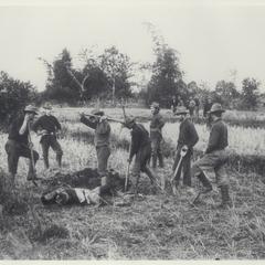 U.S. soldiers dig a grave for a fallen Filipino enemy, 1899