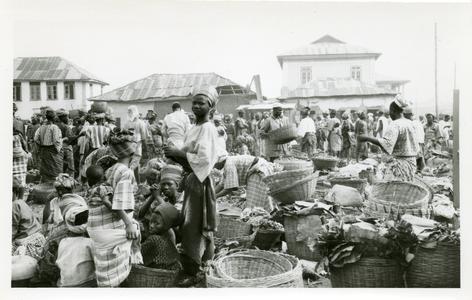 Women around baskets at market