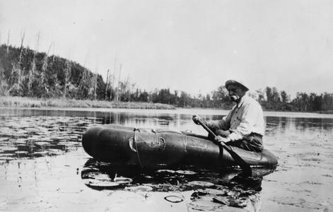 Edward A. Birge rowing on a lake