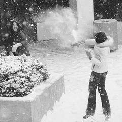 Two female students in snowball fight