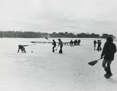 Students playing broom ball on Lake Wyllie