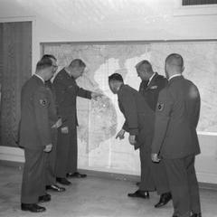 ROTC staff examine map of Vietnam