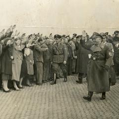 Crowds saluting Nazi officers