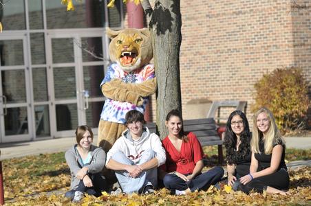 Students in courtyard with Corby the Cougar
