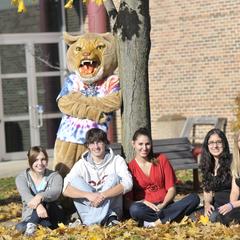Students in courtyard with Corby the Cougar