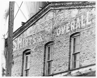 Janesville Shirt and Overall factory sign