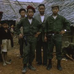 Ethnic Hmong official with soldiers