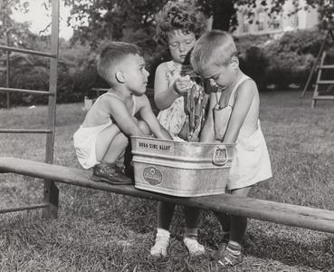 Children play in bucket