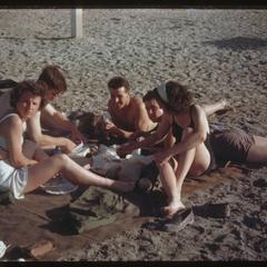 Red Cross girls and GIs on the beach