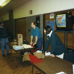 Stout Student Association, Mark Dallenbach and Lisa Huss standing at Stout Student Association information table