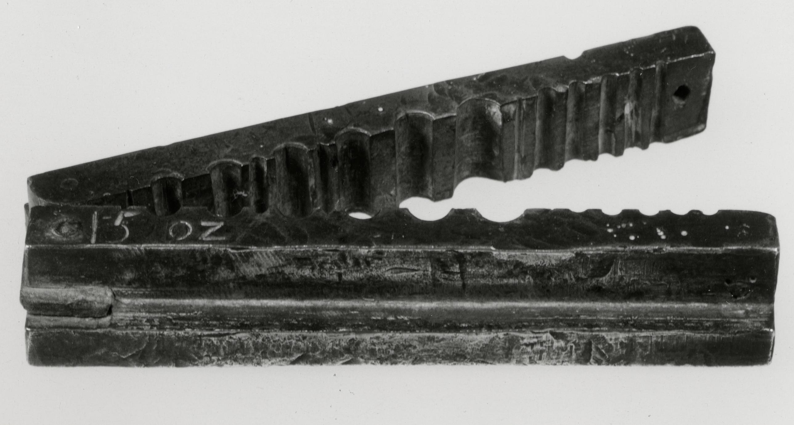 Black and white photograph of a wire vise.