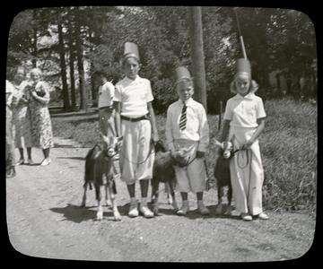 Three children with goats, Wilmot Fair