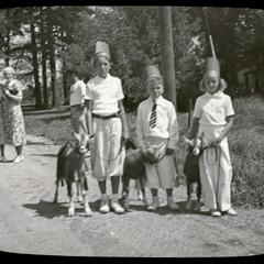 Three children with goats, Wilmot Fair