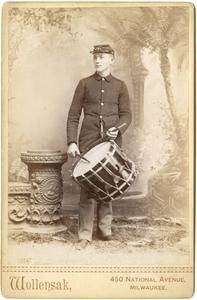 Standing man playing drum