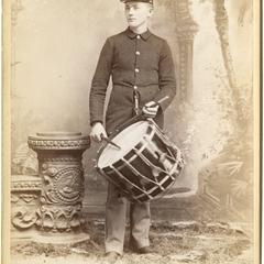 Standing man playing drum