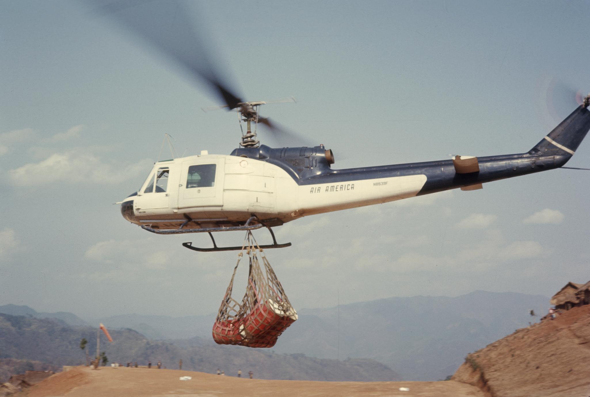 ‎Helicopter transporting cargo - UWDC - UW-Madison Libraries