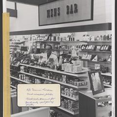 A man stocks shelves at the Mens Bar in a drugstore