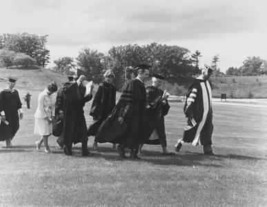 Faculty recessional in outdoor commencement ceremony