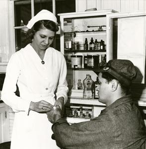 Safety is Golden : Nurse at Manitowoc Shipbuilding Company "hospital"